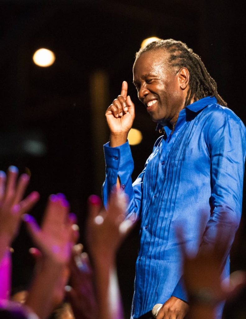 The signal: David Rudder gives a signal to his audience during his 60th birthday concert at Queen's Park Savannah, Port of Spain in June, 2013. On Saturday, Rudder again celebrates at the concert 6.5, the night before his birthday on Sunday. PHOTO COURTESY MARIA NUNES