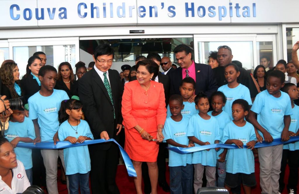 In this August 14, 2015 file photo, prime minister Kamla Persad-Bissessar cuts the ribbon to open the Couva Children’s Hospital along with the Chinese ambassador Huang Xingyuan, left, and health minister Dr Faud Khan. Now under the Dr Keith Rowley government, the hospital is to be managed under a public partnership agreement with InterHealth Canada.