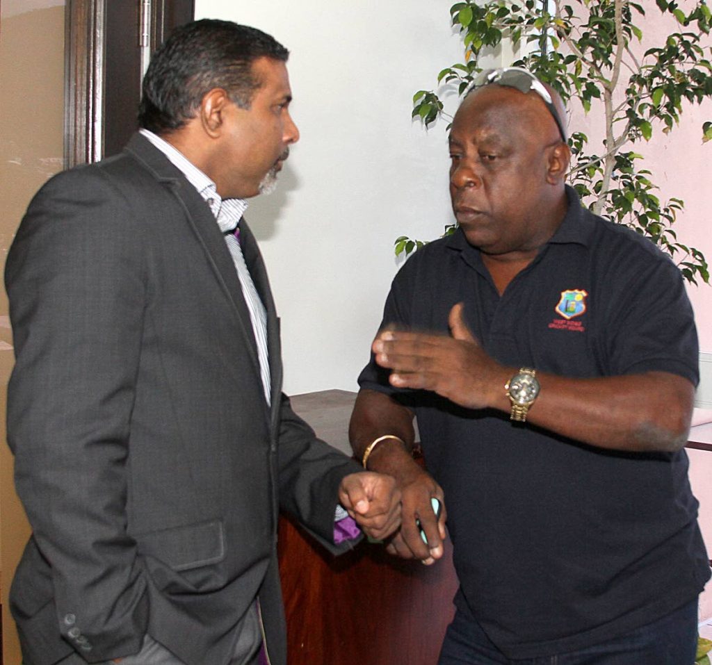 Sport Company Chairman Dinanath Ramnarine, left, chats with Lockhart 
Sebastian during a press conference earlier this year to announce a charity T20 to raise funds for hurricane-ravaged Caribbean countries.