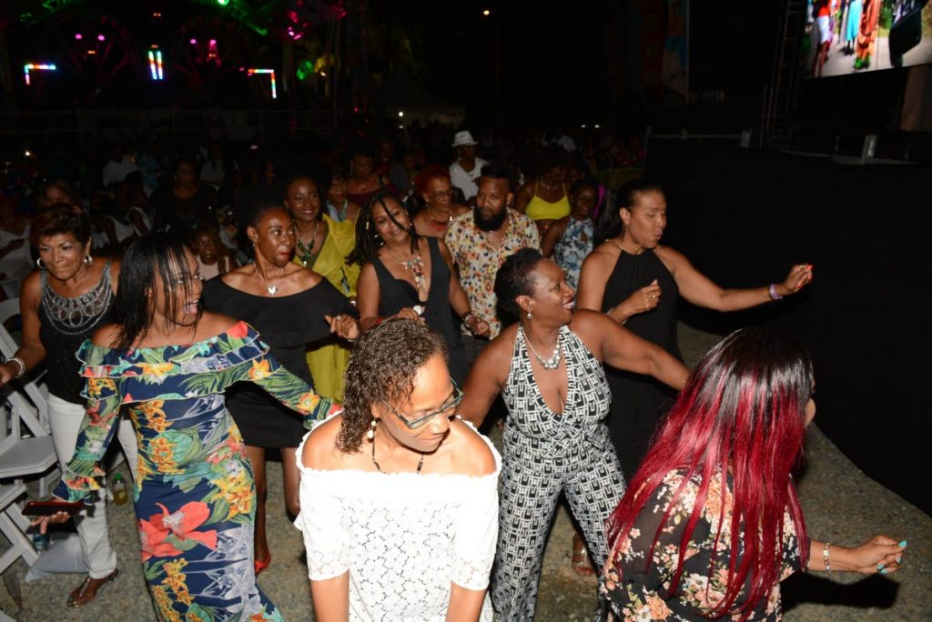 Patrons dance the beat of music, enjoying the performances from artistes  at the International Music Night at the 2018 Tobago Jazz Experience on Sunday at the Pigeon Point Heritage Park.