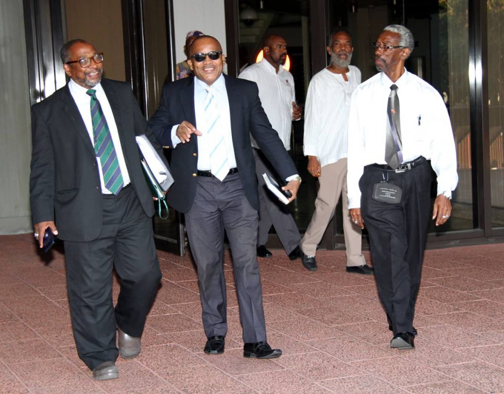 Pan Trinbago Secretary Richard Forteau (far left)  leaves Hall of Justice with his attorneys. PHOTO SUREASH CHOLAI