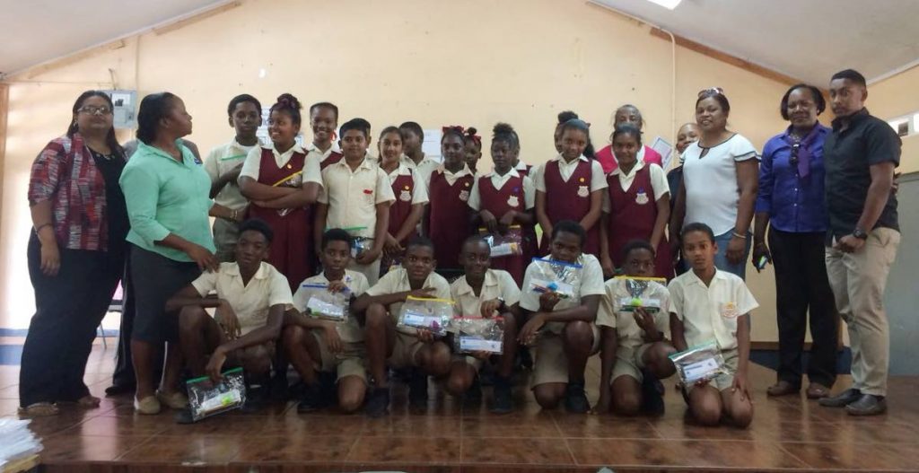 Pupils of St Brigid’s Girls RC school, Siparia, with their SEA kits presented to them by staff of the La Brea constituency. School teacher Donyale Saney Trotman (left).