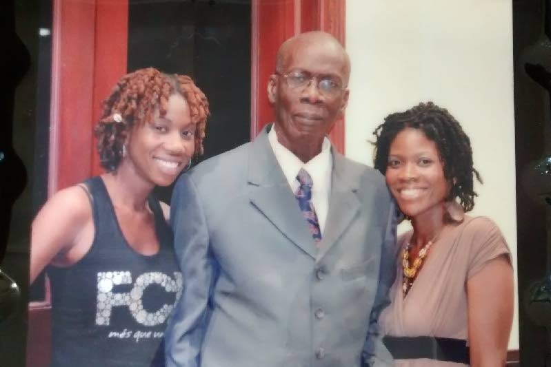 Dr Morgan Job with his daughters Dzifa, left, and Nzinga.