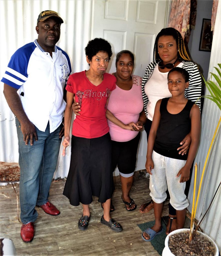 Michael Neverson, left, with Maria and Marcia Yorke, Dharia Nelson-Seales and Jeavon Yorke.  Neverson came in from New Jersey to assist the Yorke family after reading of their plight which was highlighted on social media by Nelson-Seales.