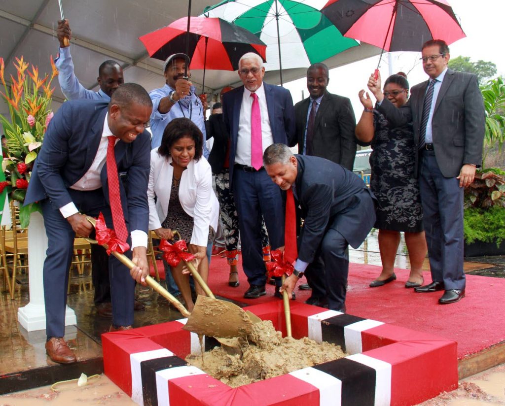 SHOVEL BOSSES: (from left) Moruga Tableland MP Dr Lovell Francis, Trade Minister Paula Gopee-Scoon and Agriculture Minister Clarence Rambharat turn the sod for the start of construction of the Moruga Agro-Processing Park yesterday.