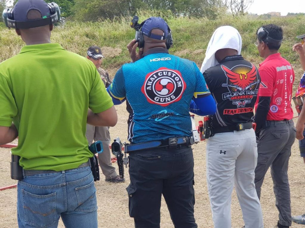 SHOOTERS: Participants take instructions before competing in the Tobago Rifle Club’s  Annual All Steel Pistol Shooting Competition on April 28, at the TRC Range, at Bay leaf Hill, John Dial, Tobago.