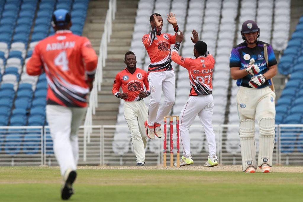 South East players celebrate their team-mate Daniel St Clair’s (#07) dismissal of North’s Joshua Da Silva (right) during the TTCB Inter Zone Seniors 50 Overs match yesterday between North and South East at 
the Brian Lara Cricket Academy, Tarouba.