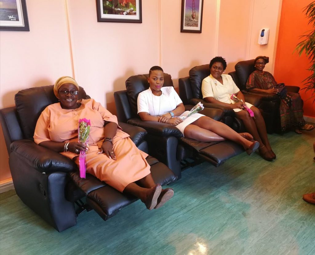Nursing staff test out reclining chairs in the first-ever Patient Discharge Lounge (PDL), Port of Spain General Hospital during a media tour on May 13, 2018. (Left to right) PDL ward maid Maureen Campbell; PDL nurse Martina Cuffy; Nursing assistant Duane David-Martin; and PoSGH nursing administrator Jacqueline Dasent. PHOTO BY SASHA HARRINANAN.
