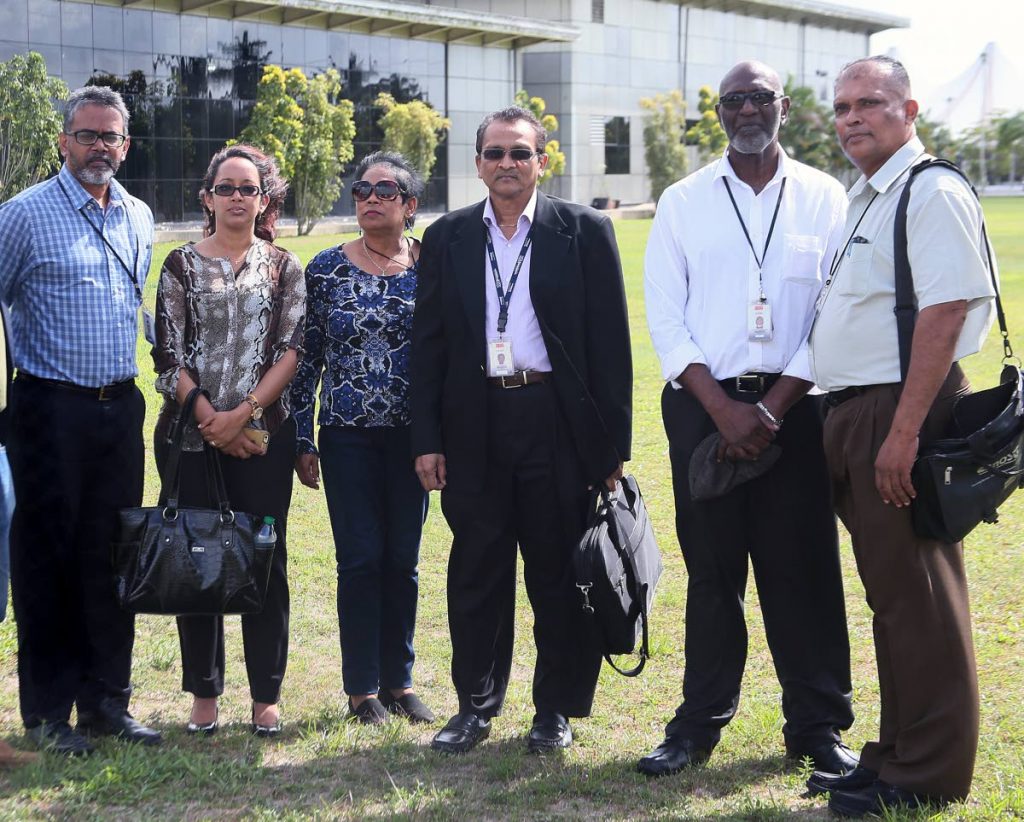 Five of the eleven UTT lecturers whose services were terminated, leave the O’Meara campus after meeting with management.  From left are Rudy Singh, Amanda Rambaran, Balmatee Sukha, Dr Kumar Mahabir, Solomon Rajnathsingh and Omar Maraj.