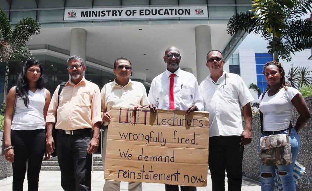FILE PHOTO: University of TT (UTT) lecturers, seen on May 14 outside the Education Ministry's head office, Edward Street, Port of Spain, are demanding reinstatement.
(Left to right) Student Sacha Mohammed, Lecturers terminated leaves the UTT O Meera campus after meeting with officials From Left Rudy Singh, Dr Kumar Mahabir, Solomon Rajnathsingh, Omar  Maraj and UTT Math student Makela Celestine who came out in support of the fired lecturers.
PHOTO BY AZLAN MOHAMMED
