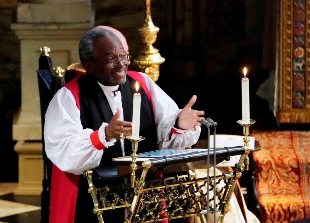 The preacher: Bishop Michael Curry, of the Episcopal Church in the US, preaches during the wedding of Prince Harry and Meghan Markle at St George's Chapel, Windsor Castle  yesterday. AP Photo