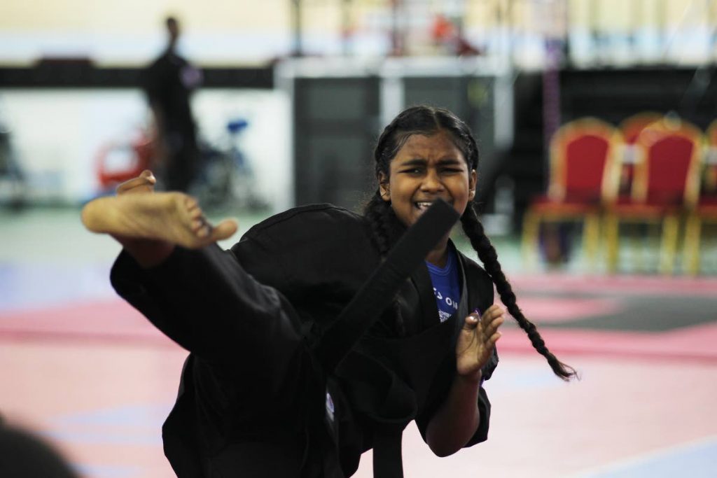 Keyanna Farfan from the Arima Dojo of Purple Dragon martial arts school competes on Saturday at the National Cycling Centre, Couva.