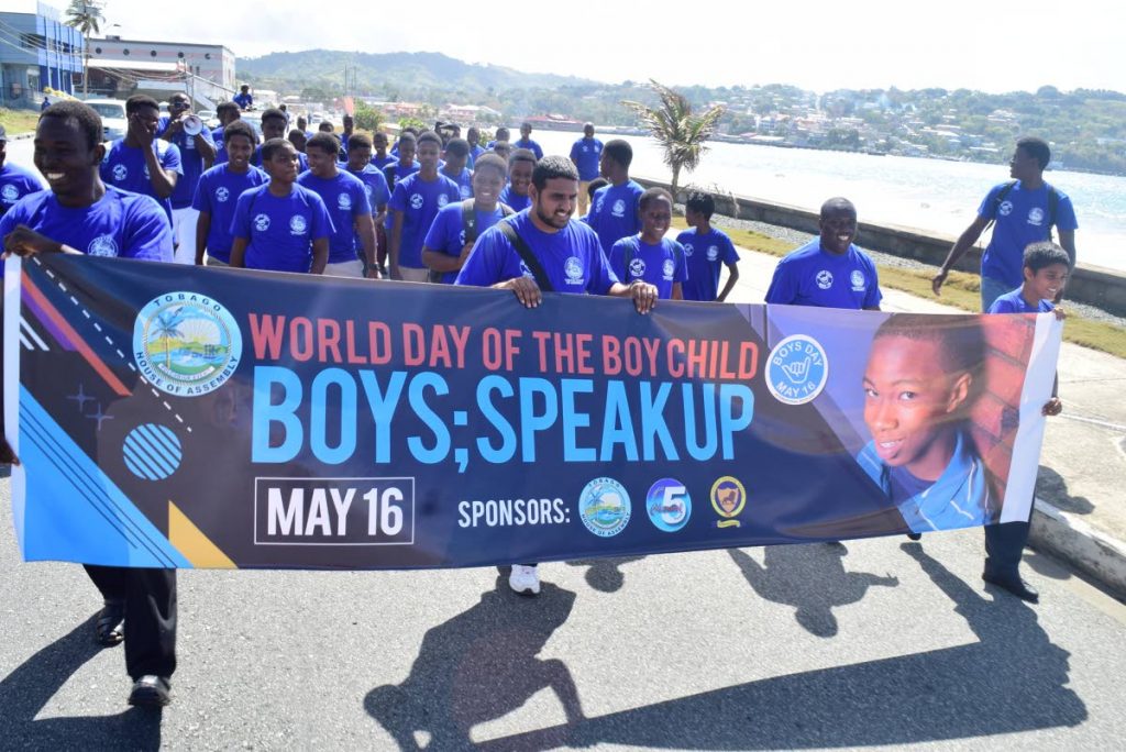 Students from Scarborough Secondary, Mason Hall High and Bishop’s High Schools walk along Milford Road, Scarborough on Friday May 18 in an event marking  of International Day of the Boy Child.