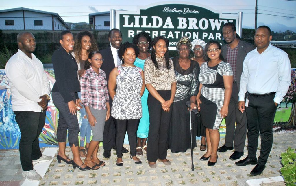 Young residents of Beetham Gardens who assisted in painting a 300-foot mural at the Lilda Brown Recreation Park celebrate the commissioning of the park with (from right) Joel Primus, Community Sustainability and Stakeholder Relations Advisor, BP Trinidad and Tobago; Adrian Leonce, MP, Laventille East/Morvant; Adanna Griffith-Gordon, councillor, Success/Trou Macaque; and Fitzgerald Hinds, MP, Laventille West; as well as Mother Lilda Brown, after whom the park is named.