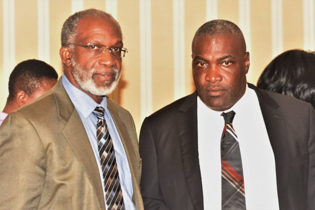 Claude Benoit, left, Chairman of the Tobago Chamber of Commerce and immediate past chairman, Demi John Cruickshank.