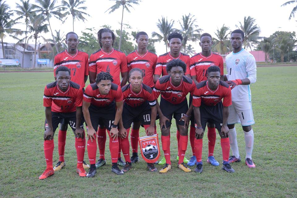Trinidad and Tobago’s men’s Under-20 team pose for a team photo in Guadeloupe.