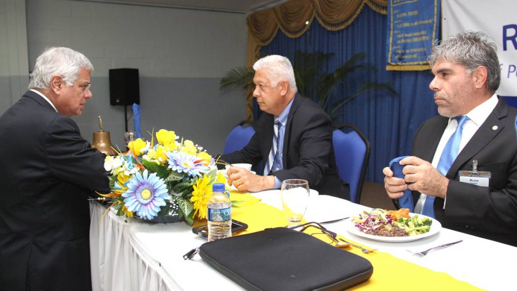 DOMA President Gregory Aboud, left, speaks to Guest Speaker, POS Mayor Joel Martinez at the Rotary Club of Port of Spain luncheon, Goodwill Industries Woodbrook. Looking on is Club President, Alain Laquis.
Photo: Angelo Marcelle.