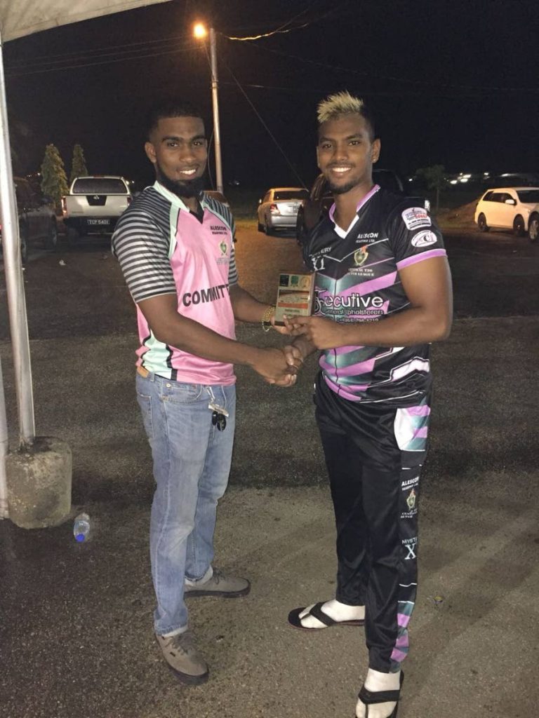 Bryan Charles presents the Man of the Match to Nicholas Pooran.Pooran blasted another half century for his team Mystery XI leading them to a comfortable eight wicket victory against LLB Combine All Stars.