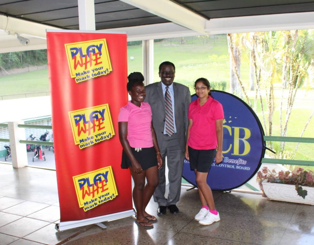Selby Browne, centre, a Director on the Board of NLCB, poses with second-placed Azariah Joseph, left, and Chloe Ajodah at the Cotton Tree Foundation Charity Golf Tournament on Wednesday. The team was also sponsored by NLCB.