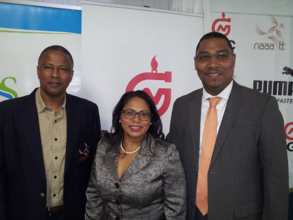 General Secretary of the NAAA, Dexter Voisin, left, poses with Sagicor’s Business Development and Marketing manager Lisa Mahabir, centre, and Ronald Adams, vice-president of Operations at NGC, at the launch of June’s various track and field championships.