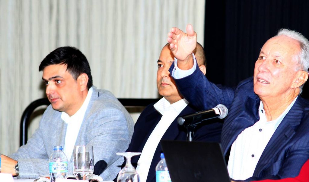 TCL chairman Wilfred Espinet, right, answers questions from shareholders alongside managing director José Luis Seijo González, left, and group financial manager Francisco Aguilera Mendoza, centre, during Friday’s AGM at Hilton Trinidad, St Ann’s. PHOTO BY ROGER JACOB