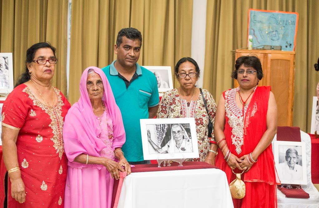 One of the last surviving indentured immigrants Dharmie Deo and her family at the launch of Voices of a Century at Chinmaya Mission, Couva on Friday. Photo by Ghansham Mohammed