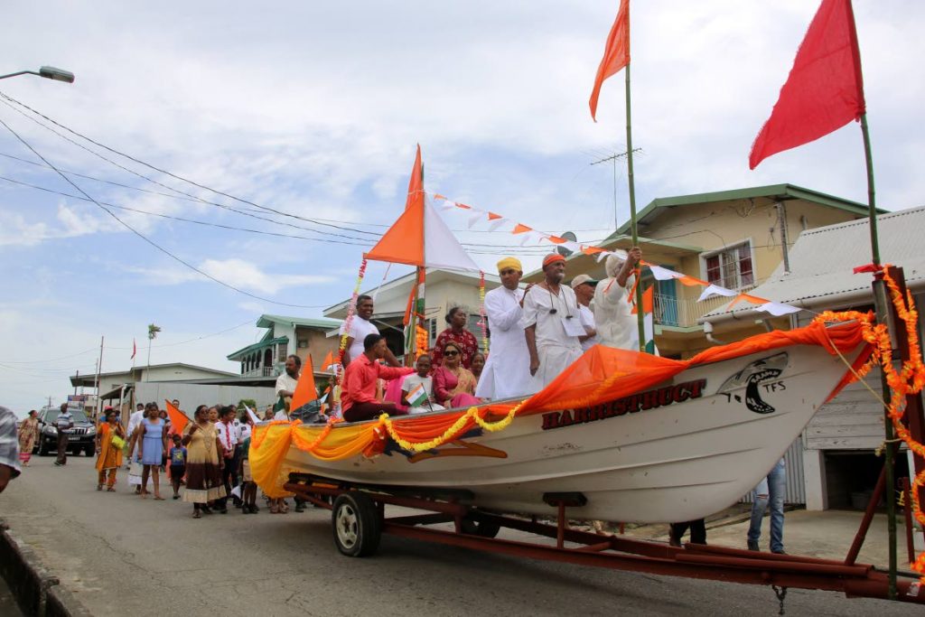 In this May 2018 file photo Opposition Leader Kamla Persad-Bissessar sits in a boat, representing the Fatel Razack on which East Indian indentured labourers came to TT from India, at Indian Arrival Day celebrations at Bonasse Village, Cedros.