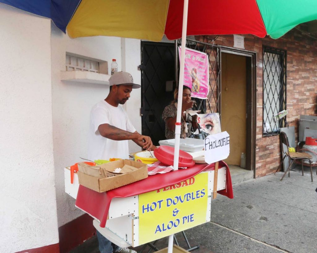 A doubles vendor in San Fernando waits for a customer