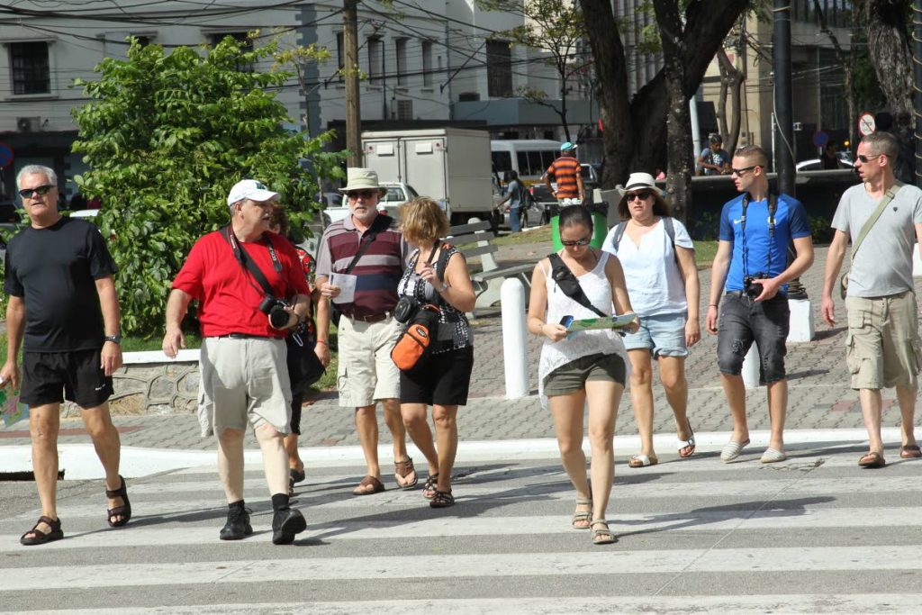 Passengers from the MSC Poesia stroll along Brian Lara Promenade, Port of Spain during a stop
in Trinidad on February 2, 2017. FILE PHOTO