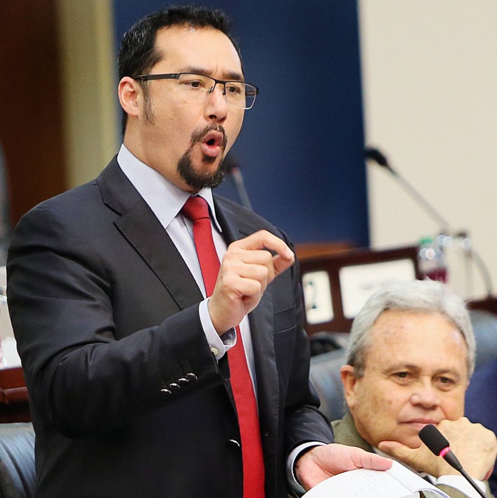 Newly appointed Communication Minister Stuart Young, who is also Minister in the Offices of the Prime Minister and Attorney General. addresses the Lower House, as Finance Minister Colm Imbert listens, during a sitting on February 23. FILE PHOTO 