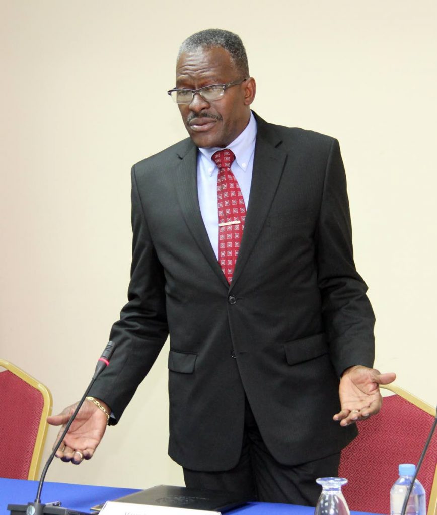 I will listen: National Security Minister Edmund Dillon fields questions from the media at the National Security Ministry, Temple Court, Port of Spain on March 23. Dillon says he is willing to meet religious leaders on robberies of places of worship. FILE PHOTO