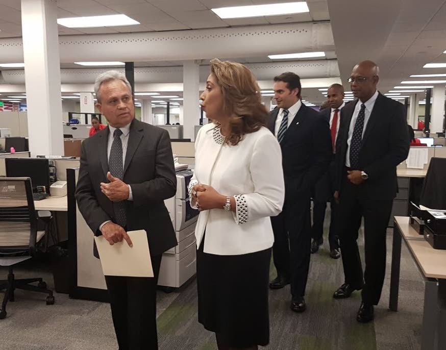 
(Left) Finance Minister Colm Imbert gets a tour of Scotiabank TT's Operations and Shared Services Company (OSSC) in Chaguanas by the company's vice-president Carlene Seudat on April 4, 2018.
Also on the tour (in back, left to right) are Scotiabank TT's managing director Stephen Bagnarol, OSSC chairman David Noel and Scotibank TT director Derek Hudson. PHOTO COURTESY SCOTIABANK TT