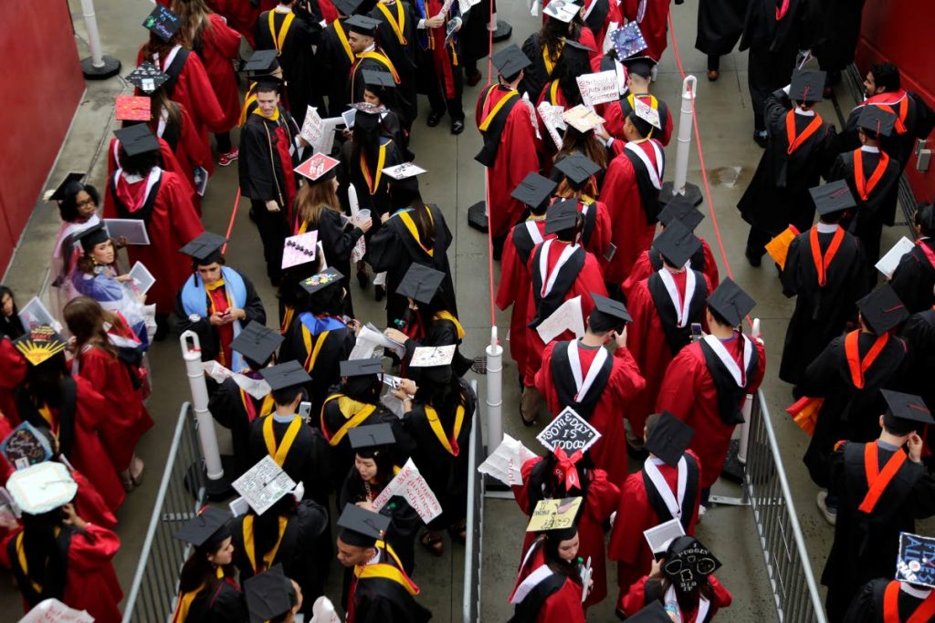 UNCERTAIN FUTURE: Many people graduate from universities and colleges every year, but complain about a lack of jobs in their fields of study.   (AP PHOTO)