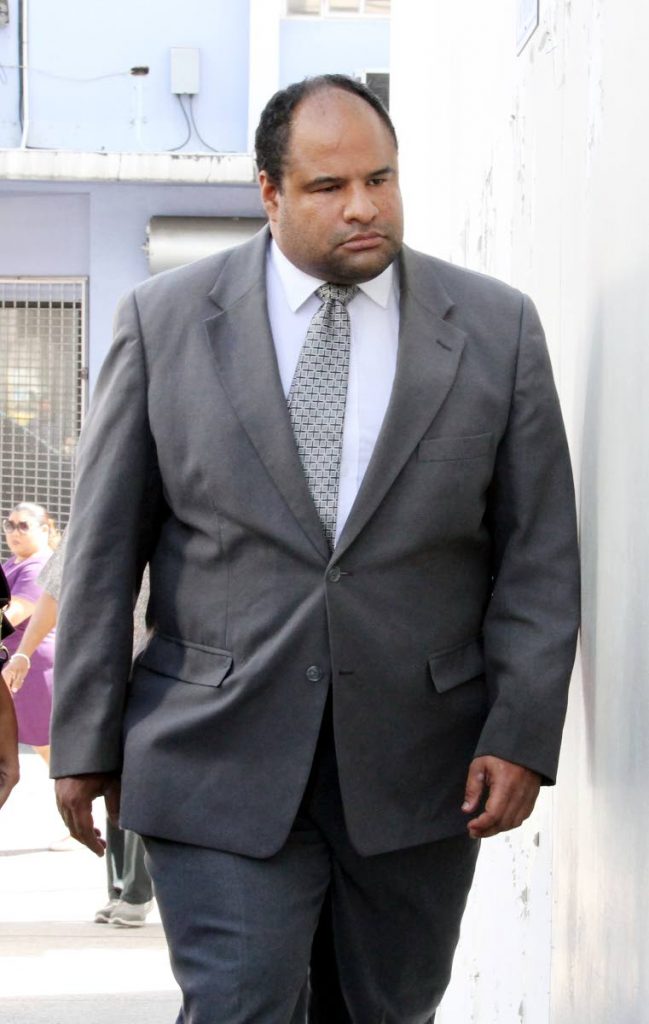 High Court judge Kevin Ramcharan on his way to the Port of Spain Magistrates Court to answer a drunk driving charge on May 28. Ramcharan pulled out of the Rainbow Cup triathlon in Tobago yesterday due to a leg muscle injury. FILE PHOTO