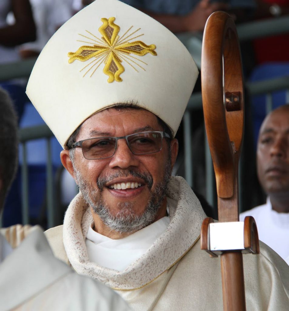 Archbishop Jason Gordon blesses pocession outside the Cathedral of the Immaculate Conception, yesterday.