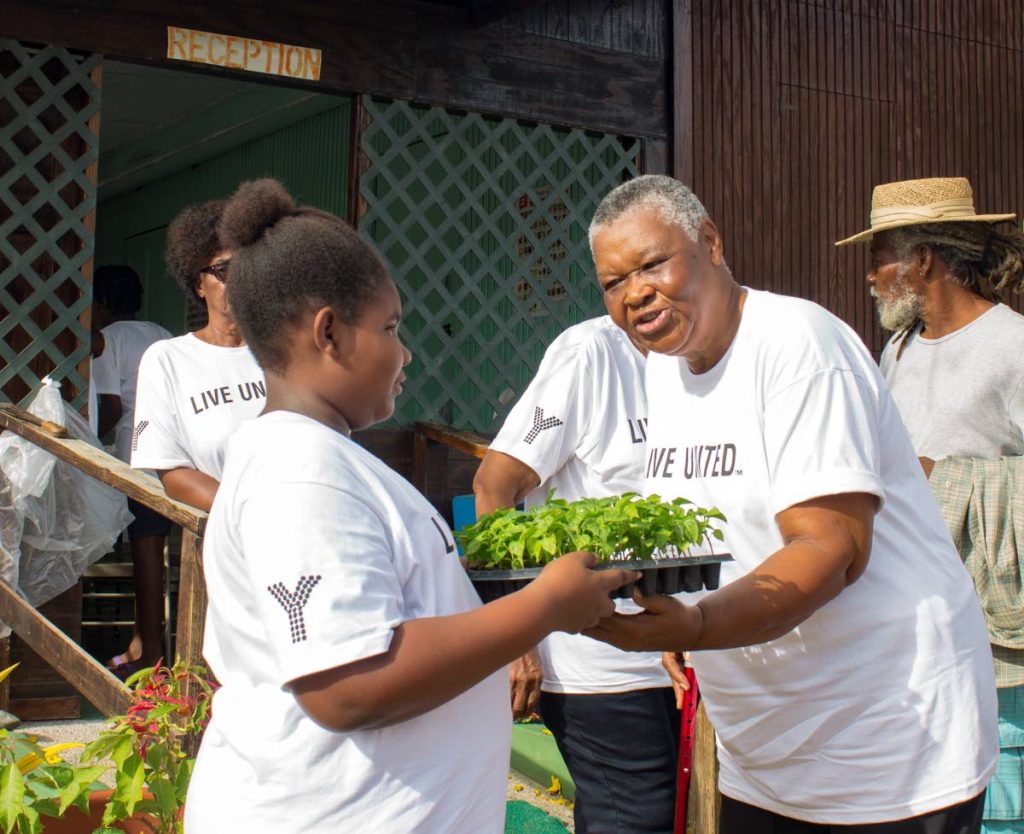  Yahweh Foundation senior Shirley Leith and foundation junior Journee Smart, during the planting activities to mark the recent National Day of Caring by the foundation in collaboration with United Way at Carnbee Gardens, Tobago.