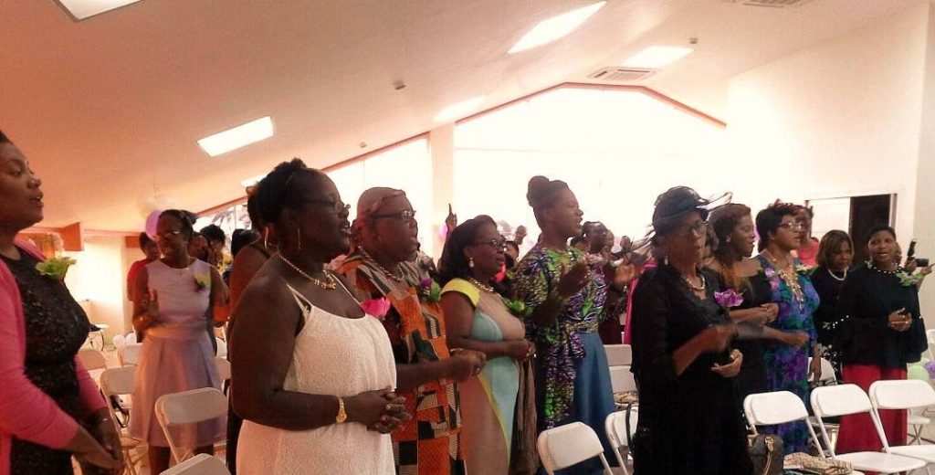 Mothers engage in worship at the annual cocktail and conference for mothers hosted by the Women of Worth Ministries of the Jesus is the Answer Praise Centre (JITA) and  the Upper Room Connections at the auditorium of the Eastern Credit Union  in Canaan on May 12.