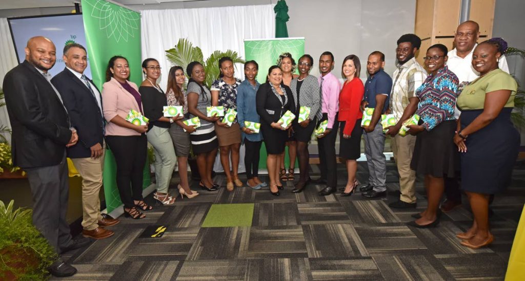 Graduates of the Brighter Prospects scholarship programme share a proud moment with management and staff of BP Trinidad and Tobago, including Ruan Mitchell (second from left), Vice President, Human Resources; and Giselle Thompson (sixth from right), Vice President, Corporate Operations.
