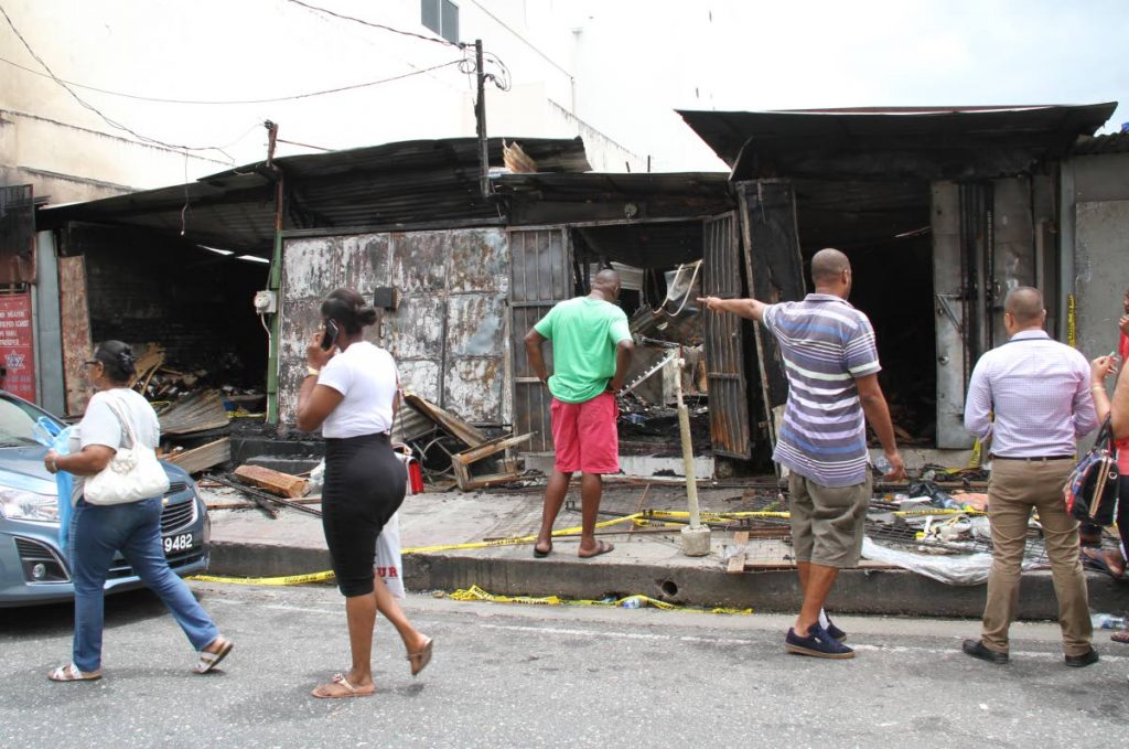 Aftermath of the fire at the People's Mall in Port-of-Spain that destroyed four shops early Sunday morning. Photo: Sureash Cholai.