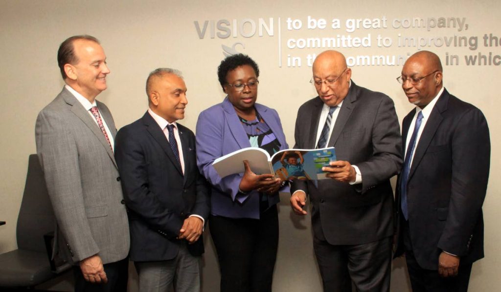 REVIEW: Sagicor’s executive team, from left, general manager Robert Trestrail, chief operating officer Ravi Rambarran, corporate secretary Althea Hazzard, group president and CEO Dodridge Miller and group chief financial controller Anthony Chandler review the group’s financial report for 2017, yesterday at the group’s Queen’s Park West office.