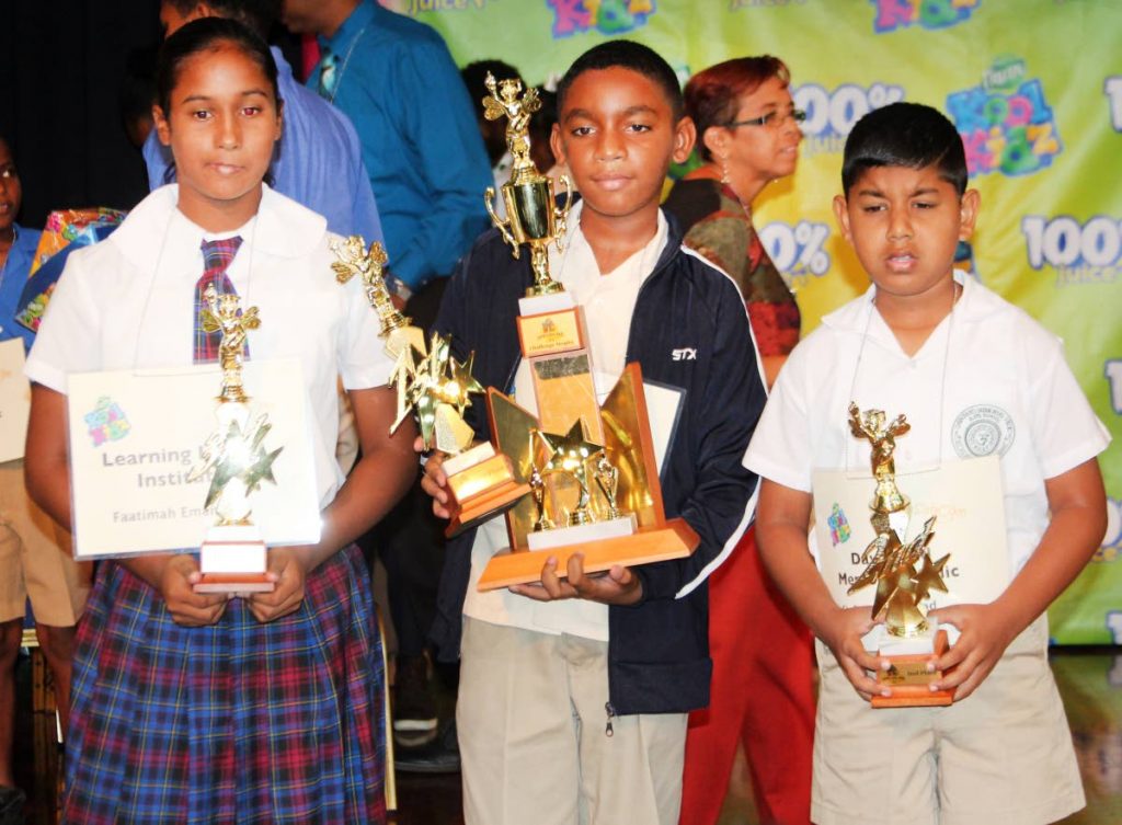 Mikkel Acquart, centre, winner of the Kool Kidz Sancom National Spelling Bee, alongside Stefan Rampersad, right, who placed second, and Faatimah Emamalie who placed third at Cipriani College of Labour and Co-operative Studies, Valsayn on June 5.