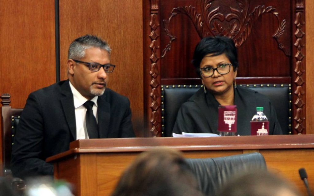 Agriculture, Land and Fisheries Minister Clarence Rambharat speaks with Senate President Christine Kangaloo during a sitting. PHOTO BY SUREASH CHOLAI