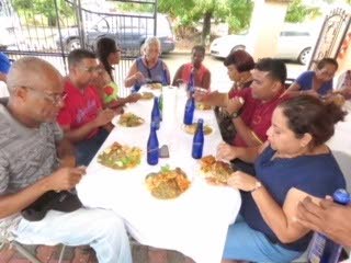 Northeasterners enjoying a sumptuous lunch in Toco.