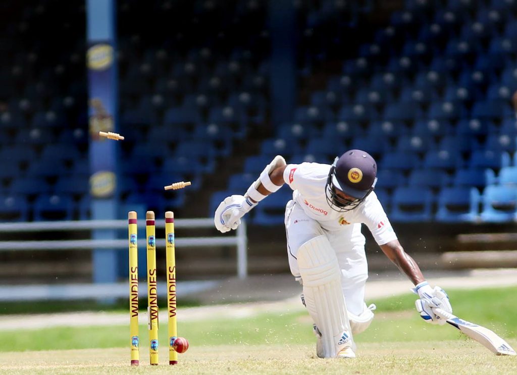 Sri Lanka’s N Dickwella is run out by Craig Brathwaite during play on Day 3 of the 1st Test  between WI and Sri Lanka at the Queen’s Park Oval Port of Spain, yesterday