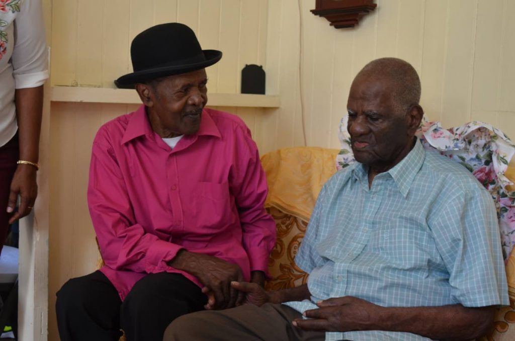 Centenarian Donald Parks, right, chats with a friend at his birthday celebrations at his Fort Street home last Saturday.