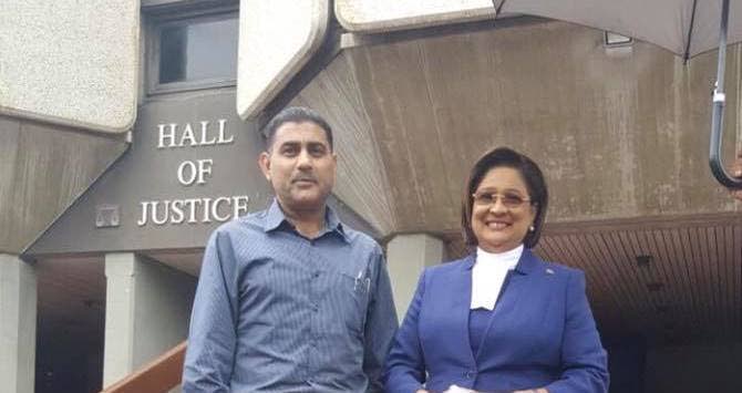 File photo: Retired Cpl Fazal Ghany and his then lawyer Kamla Persad-Bissessar at the Hall of Justice in Port of Spain in 2017. 