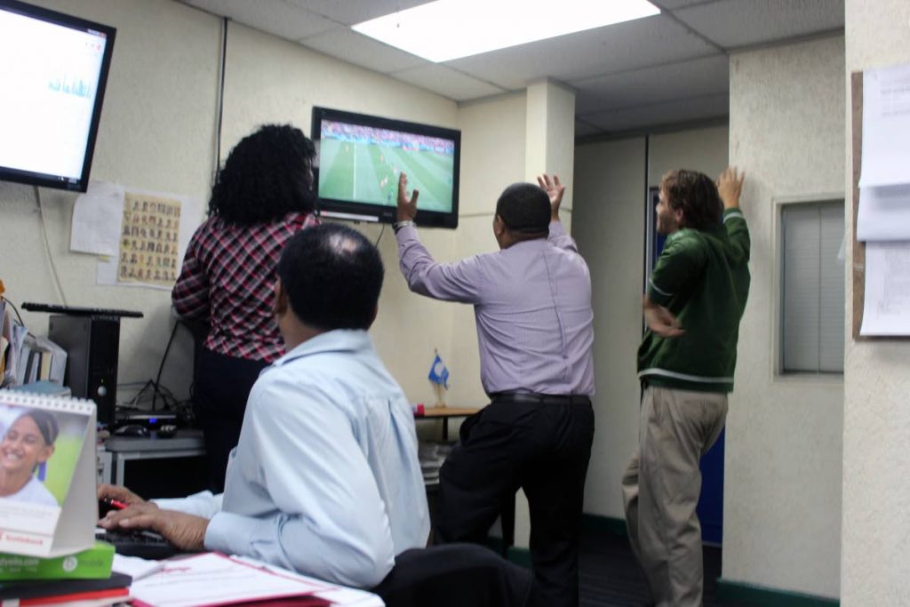 Workers took some time to watch the world cup game with Russia and Saudi Arabia today. Photo: Enrique Asson