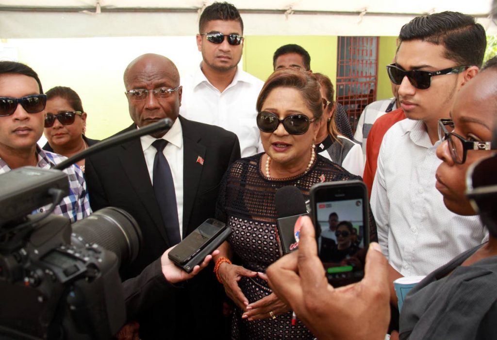 Opposition Leader Kamla Persad Bissessar surrounded by opposition MP's and councillors speaking to reporters after the funeral service for Eric Ganesh, which took place at St. Charles Village Princes Town.
PHOTO BY ANIL RAMPERSAD.