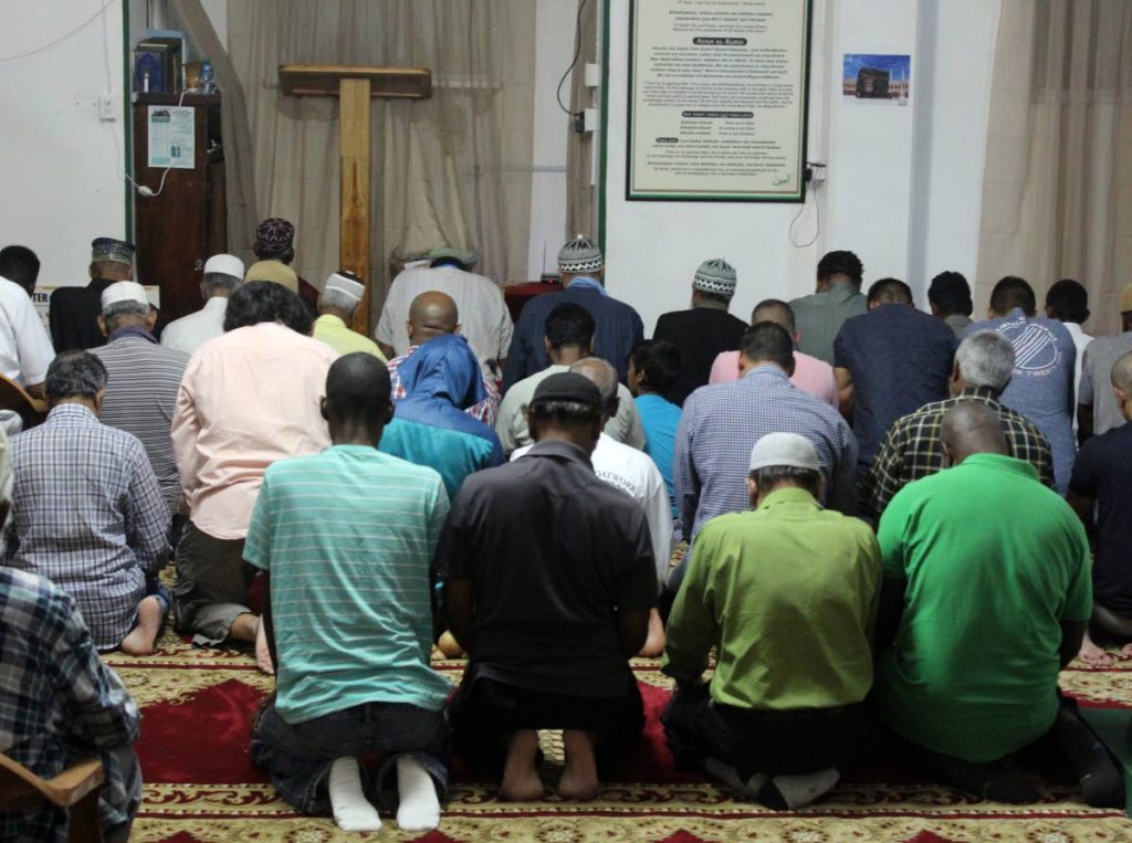 THIS IS OUR FAITH: Members of the St James mosque pray yesterday evening after 
breaking fast. PHOTO BY ENRIQUE ASSOON