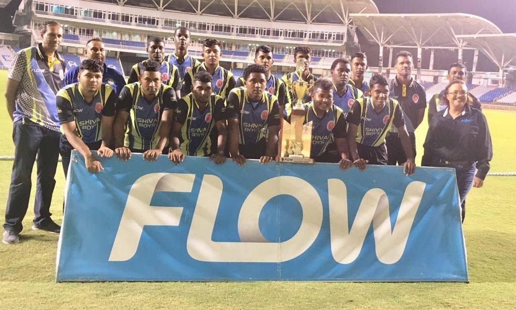 Shiva Boys Hindu College players and coaching staff celebrate after winning the Flow SSCL T10 title with Cindy Ann Gatt, director of marketing at Flow, and officials of the SSCL.